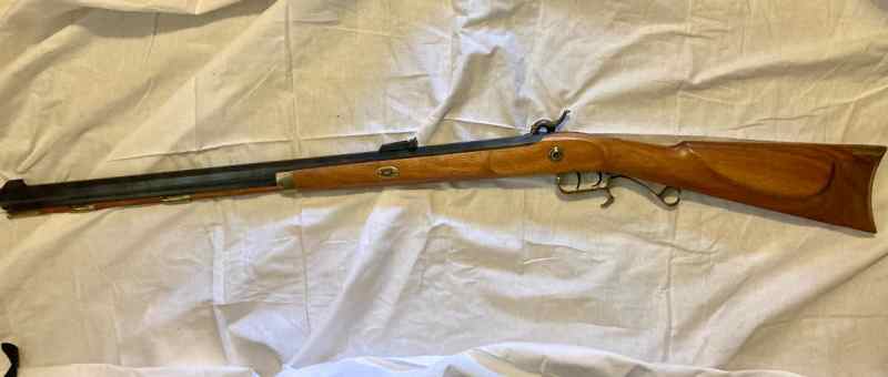 TC Hawken Rifle .54 with shooting gear.