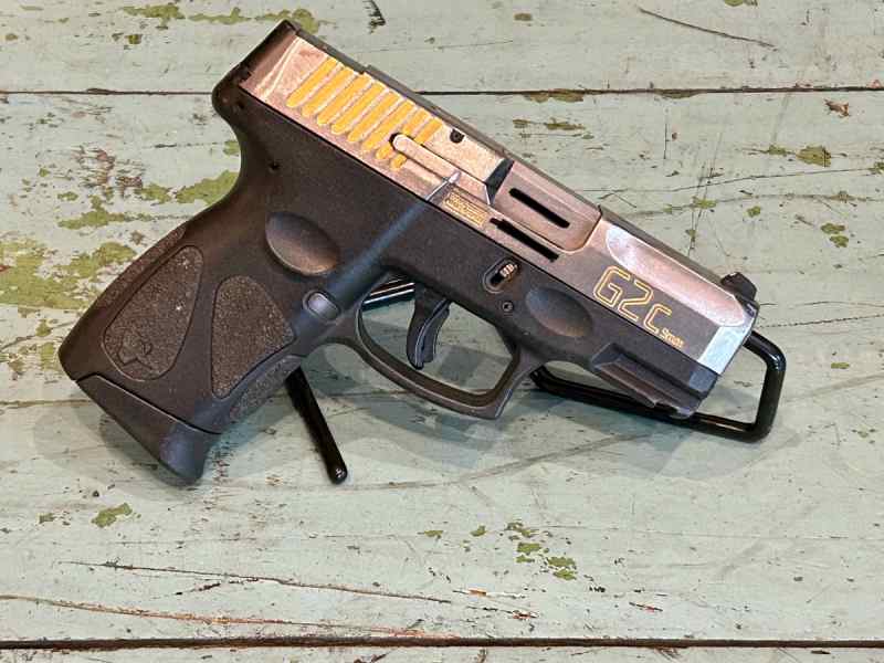 Taurus G2c with chrome slide and gold accents