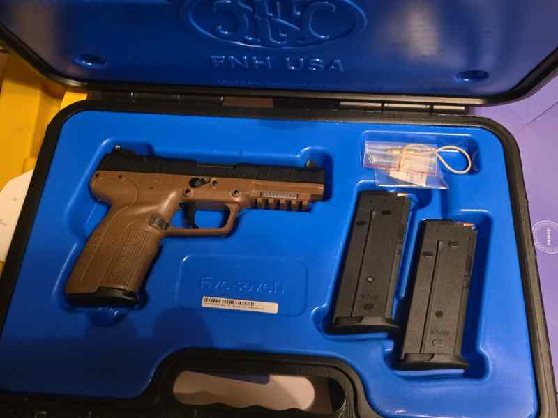 Fn 5.7 with tons of ammo and extra mags