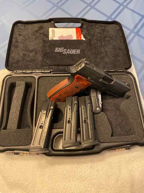 3 firearms for sale, two pistols, and one rifle