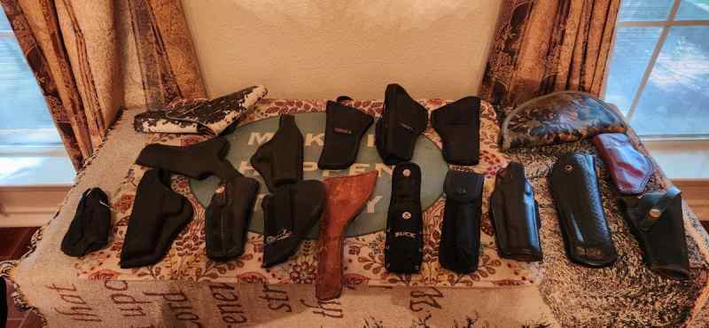 A Lot of Holsters, Slings and Gear